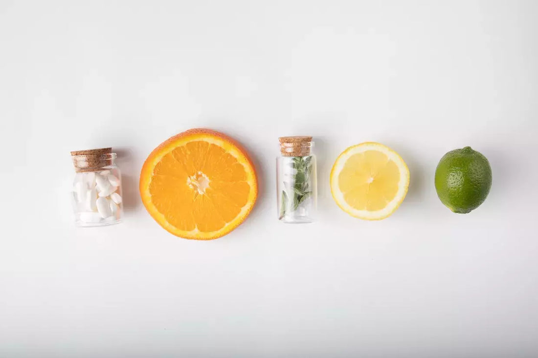 citrus fruits lined up with medicines in a bottle